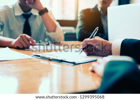 Boardroom with human resource business people writing on paper with sign a contract.