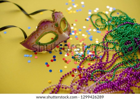 Mask, beads and confetti festival. Selective focus. Carnival. Mardi gras. Brazilian carnival. Spring