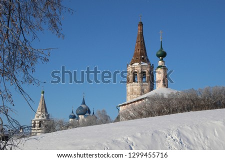 earthworks in Suzdal with snowy landscape of frosty trees and old churches