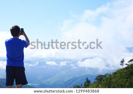 Man photographing the mountains