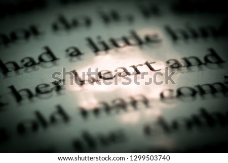 The word heart in a book close-up macro. 