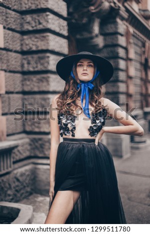 fashionable hat over a scarf, fashionable image, fashion details headdress, fashion hat details, beautiful girl in black hat