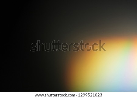 Lens flare effect. Photo using prism. Bottom right corner in rainbow illumination