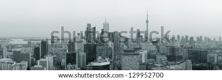 Toronto at dusk with city light and urban skyline with skyscrapers in black and white