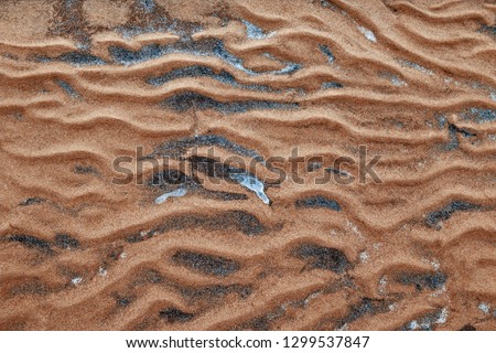 sand texture close-up uneven with dunes and alluvium