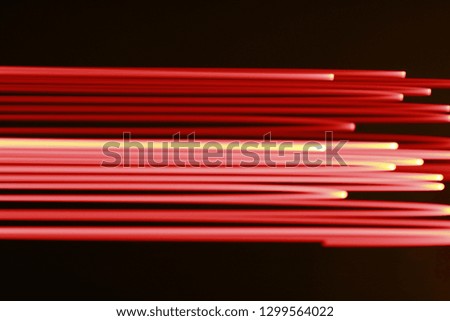 Abstract background in the form of light red stripes and a dark background