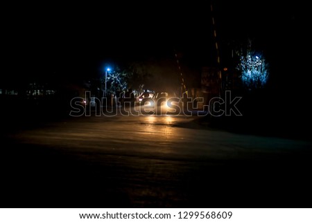 City roads with traffic and people.Shot taken at night time.
