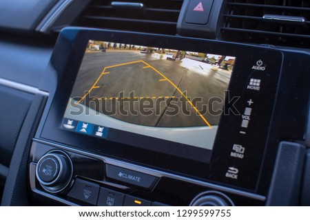 Car rear view system monitor reverse video camera. Royalty-Free Stock Photo #1299599755