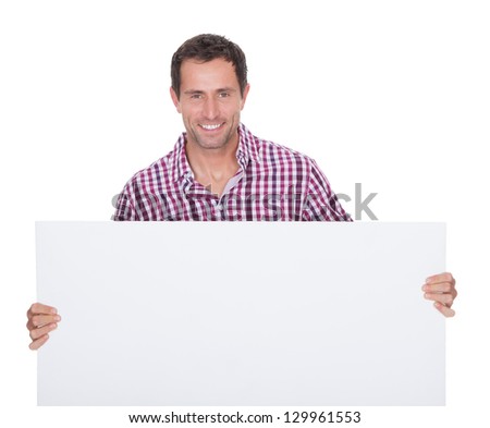 Portrait Of Young Man Holding Placard Isolated On White Background