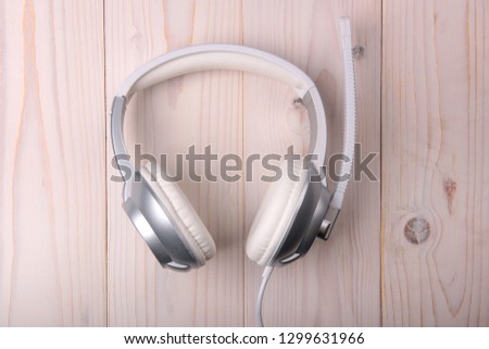 White stylish headphones on a light background
