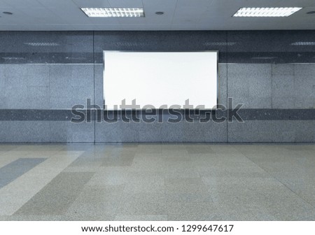 blank billboard white screen LED horizontal advertising banner board indoor in subway station public hall.