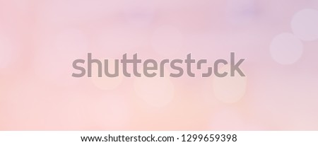abstract blurred beautiful glowing pastel color of pink and yellow gradient in panoramic image background with double exposure bokeh light concept for wedding card design or presentation or other