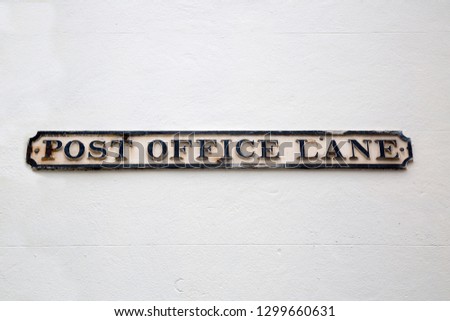 Post Office Street Sign on White Wall