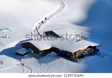 Chalet covered with snow in the Transylvanian Alps, Romania, Europe