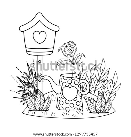 cute birdhouse with garden and sprinkler