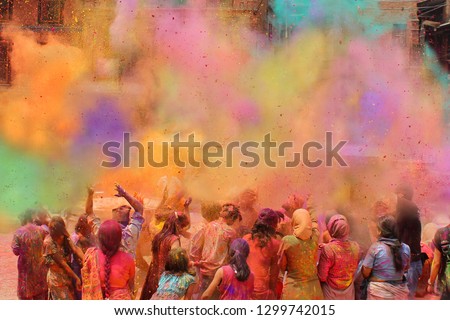 People celebrating the Holi festival of colors in Nepal or India Royalty-Free Stock Photo #1299742015