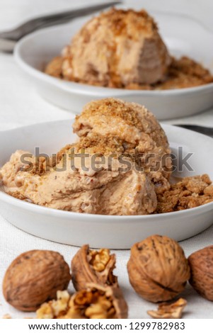 two portions of walnut ice cream 