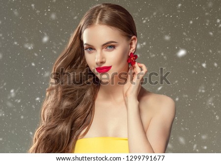Beautiful hair woman winter background snowflakes
