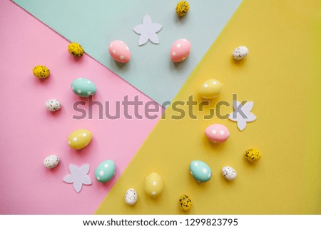Set of colored eggs on a colorful background. Festive Easter background. In the middle there is a place for text.