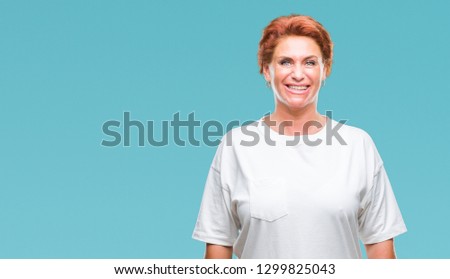 Atrractive senior caucasian redhead woman over isolated background with a happy and cool smile on face. Lucky person.