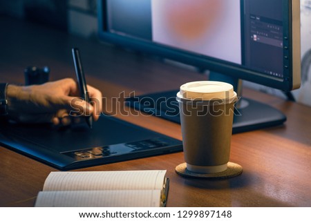Desktop side view. Computer Graphics Tablet Diary Cup of coffee Hand. Concept for website banner, mockup, background, presentation and marketing material