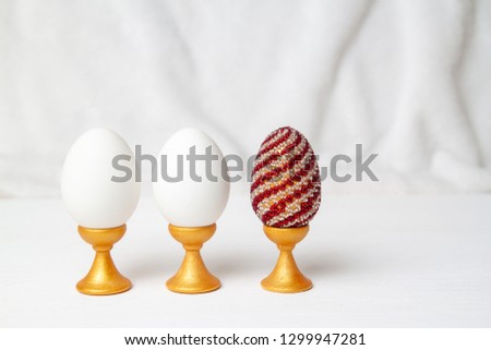 two white egg and color . White background. Preparation for Religious Easter, Resurrection of Jesus Christ.