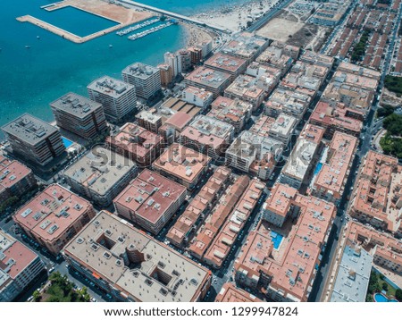 Aerial photo of harbour Naufragos Acequion, residential houses, highways and Mediterranean Sea of Torrevieja. High angle view famous popular travel destination. Costa Blanca. Alicante province. Spain.