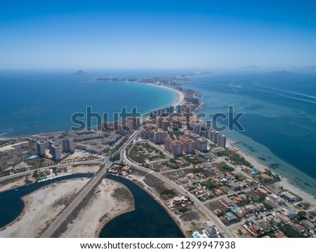 Aerial photo of buildings, villas and the beach on a natural spit of La Manga between the Mediterranean and the Mar Menor, Cartagena, Costa Blanca, Spain. 16