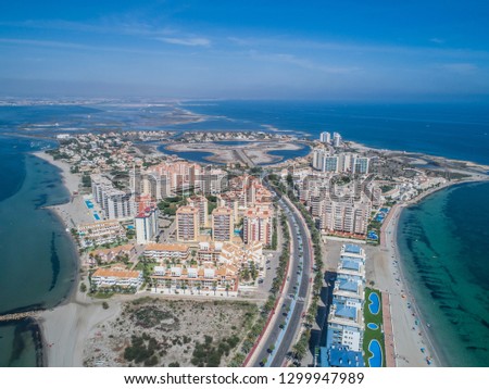 Aerial photo of tall buildings and the beach on a natural spit of La Manga between the Mediterranean and the Mar Menor, Cartagena, Costa Blanca, Spain. 12