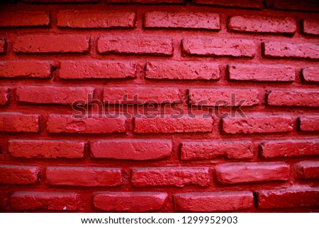 Wall of residence Built with bricks and painted red and black to look strange.