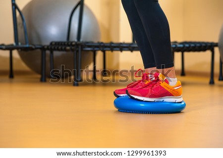 Legs of a girl involved in sports in gym
