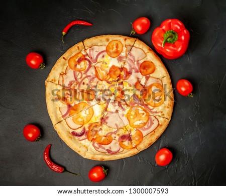 Delicious   pizza on a concrete background. Top view of hot pizza. 