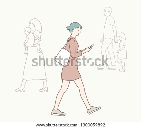 A woman is walking down the street watching a cell phone. hand drawn style vector design illustrations.