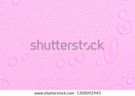 Close up water drops on rose pink tone background. Abstract purple wet texture with bubbles on plastic PVC surface or grunge. Realistic pure water droplets condensed. Detail of canvas leather texture