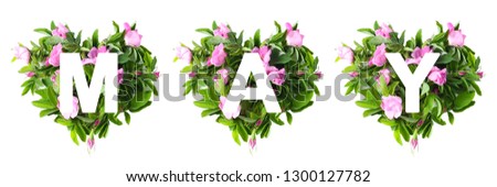 symbols laid out with fresh flowers and leaves. four hearts in which the text is written - MAY. creative layout, holiday concept, flat lay,top view