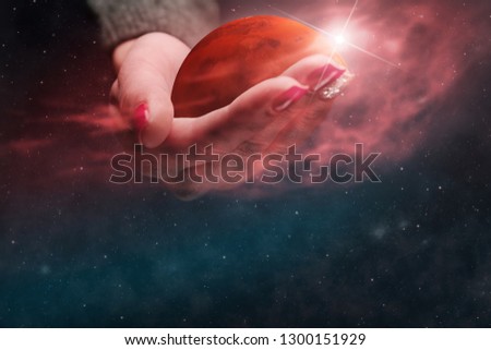 Woman holding New Home Mars. Nebula dust. Mixed media.
