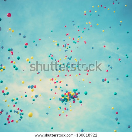 Happy colored balloons in flight