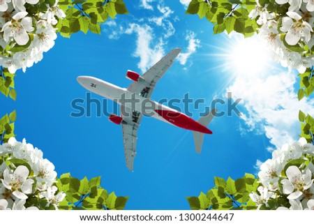 green flowers and plane in sunny sky