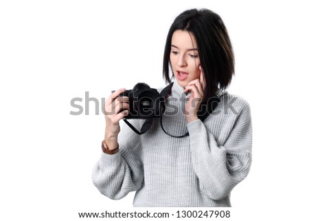 beautiful girl taking photos using camera over isolated background stressed with hand on head, shocked with shame and surprise face, angry and frustrated. Fear and upset for mistake