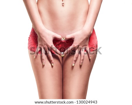 Women's hips and arms in the shape of a heart on white background