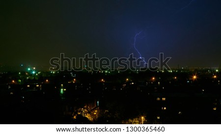 Lightning strike in the city Kyiv. Storm outside. Thunderstorm with lightning in the city. Moment lightning