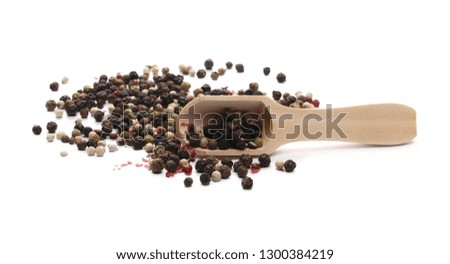 Colorful mixed pepper in wooden spoon isolated on white background