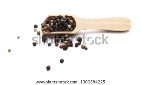 Colorful mixed pepper in wooden spoon isolated on white background