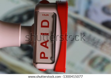 Paid stamp resembling financial world and money side view