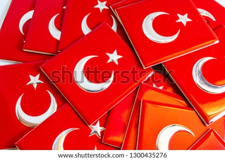 close up Turkish flag objects with moon and star on red color