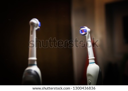 Electric toothbrush. Dark background. Lavender and mirror. dental care Bathroom
