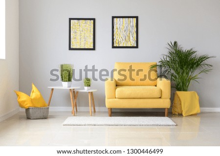 Interior of modern room with comfortable armchair