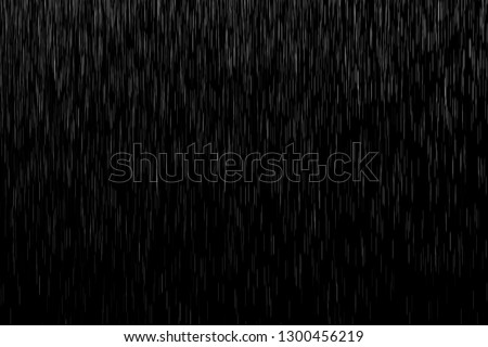 Abstract splashes of Rain and Snow Overlay Freeze motion of white particles on black background Royalty-Free Stock Photo #1300456219