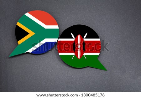 South Africa and Kenya flags with two speech bubbles on dark gray background
