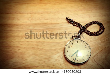 Vintage Watch on the Wooden Background